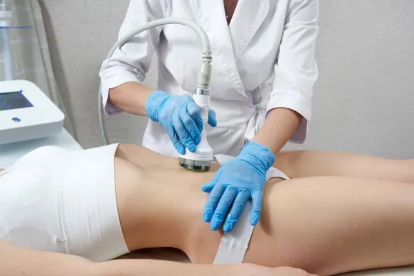 Lost the Weight but Not the Loose Skin? 2 woman having HIFU treatment on her stomach to combat loose skin Camden following weight loss
